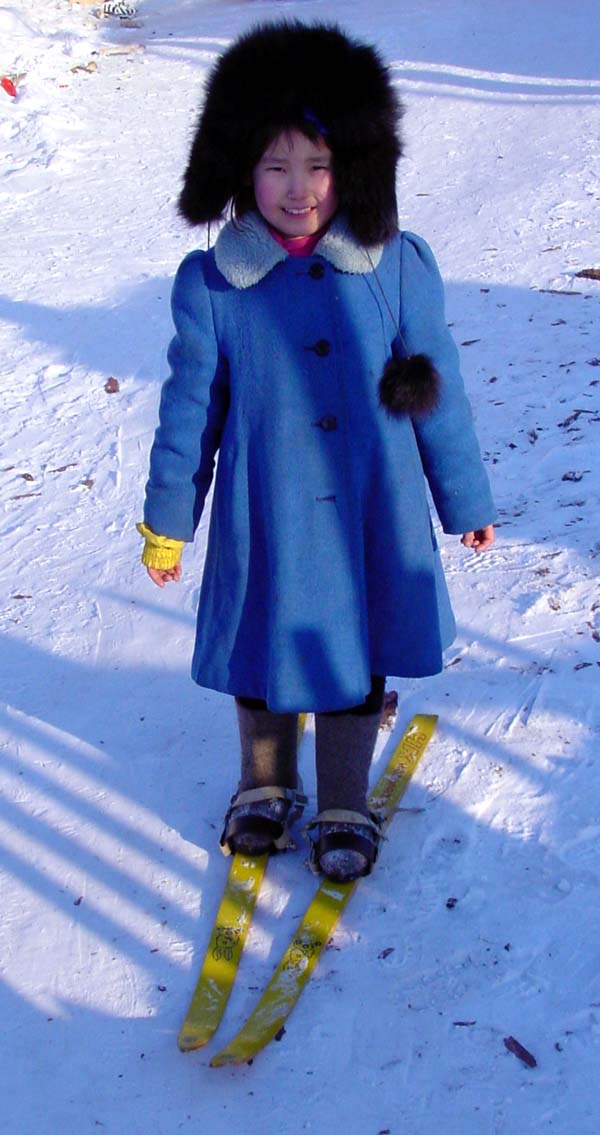 Little girl in II Khomustakh on home-made skis